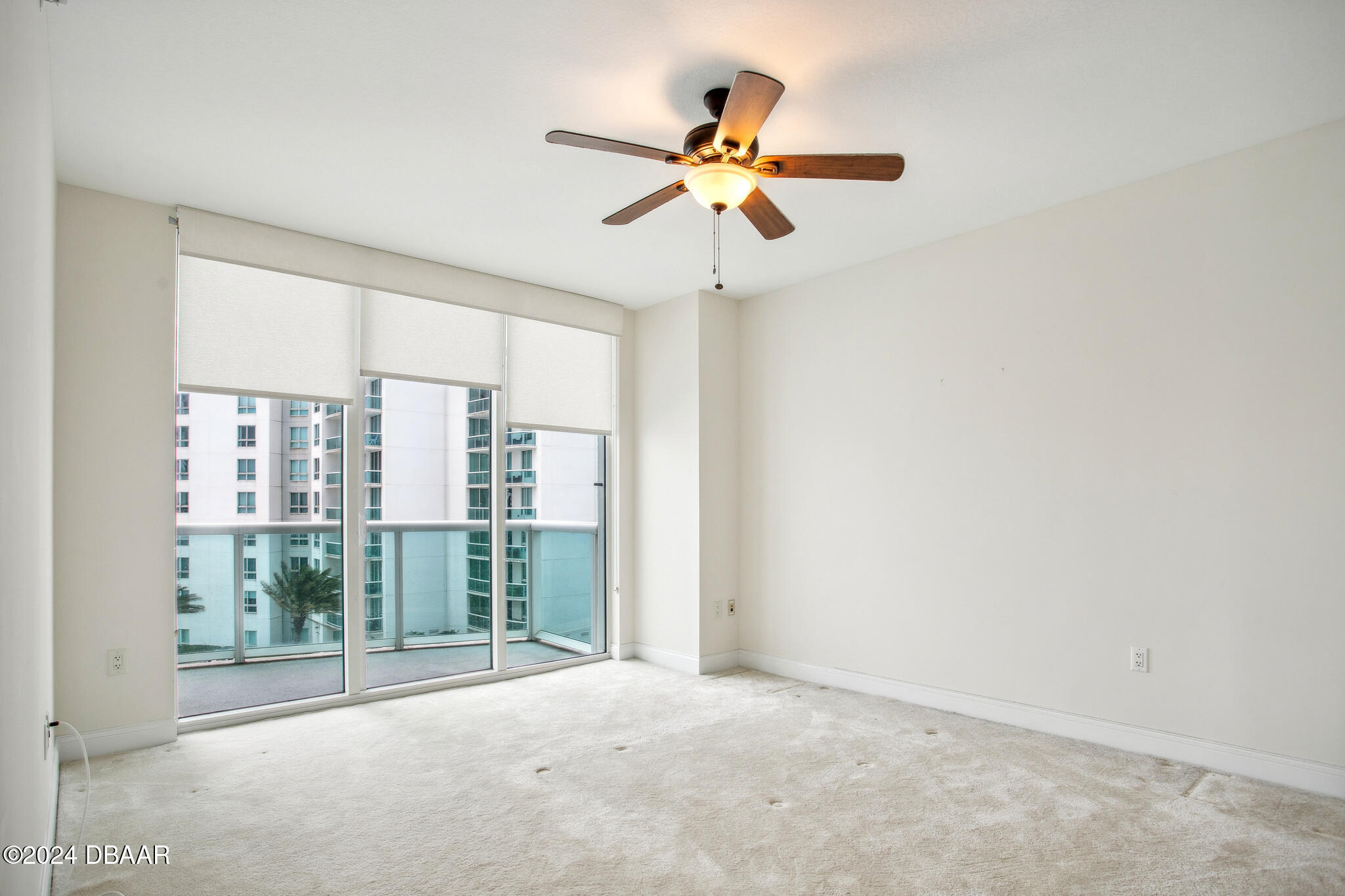 241 Riverside Drive Daytona Beach, FL 32117 - Photo 7 of 20 a view of a room with a ceiling fan and window