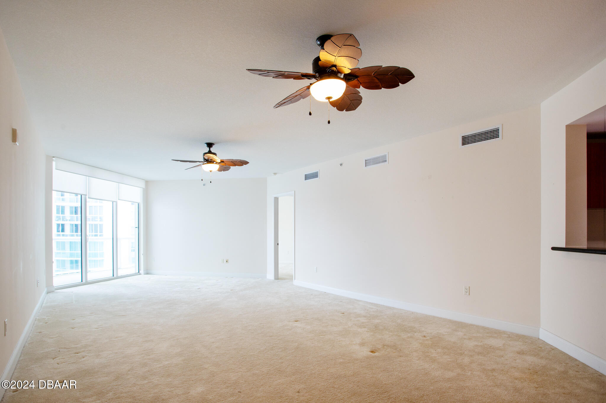 241 Riverside Drive Daytona Beach, FL 32117 - Photo 8 of 20 an empty room with a window and a ceiling fan