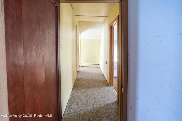 a view of a room that has a door in it