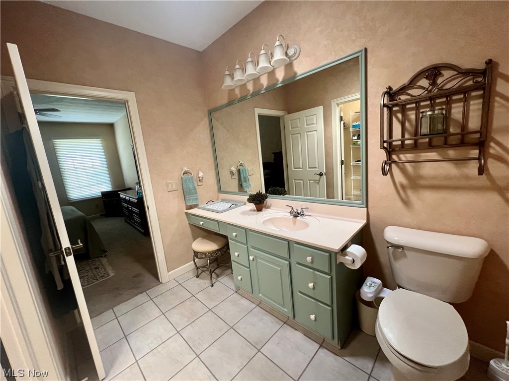 185 B Mathews Road Youngstown, OH 44512 - Photo 24 of 35 Bathroom with light tile floors, mirror, and vanity