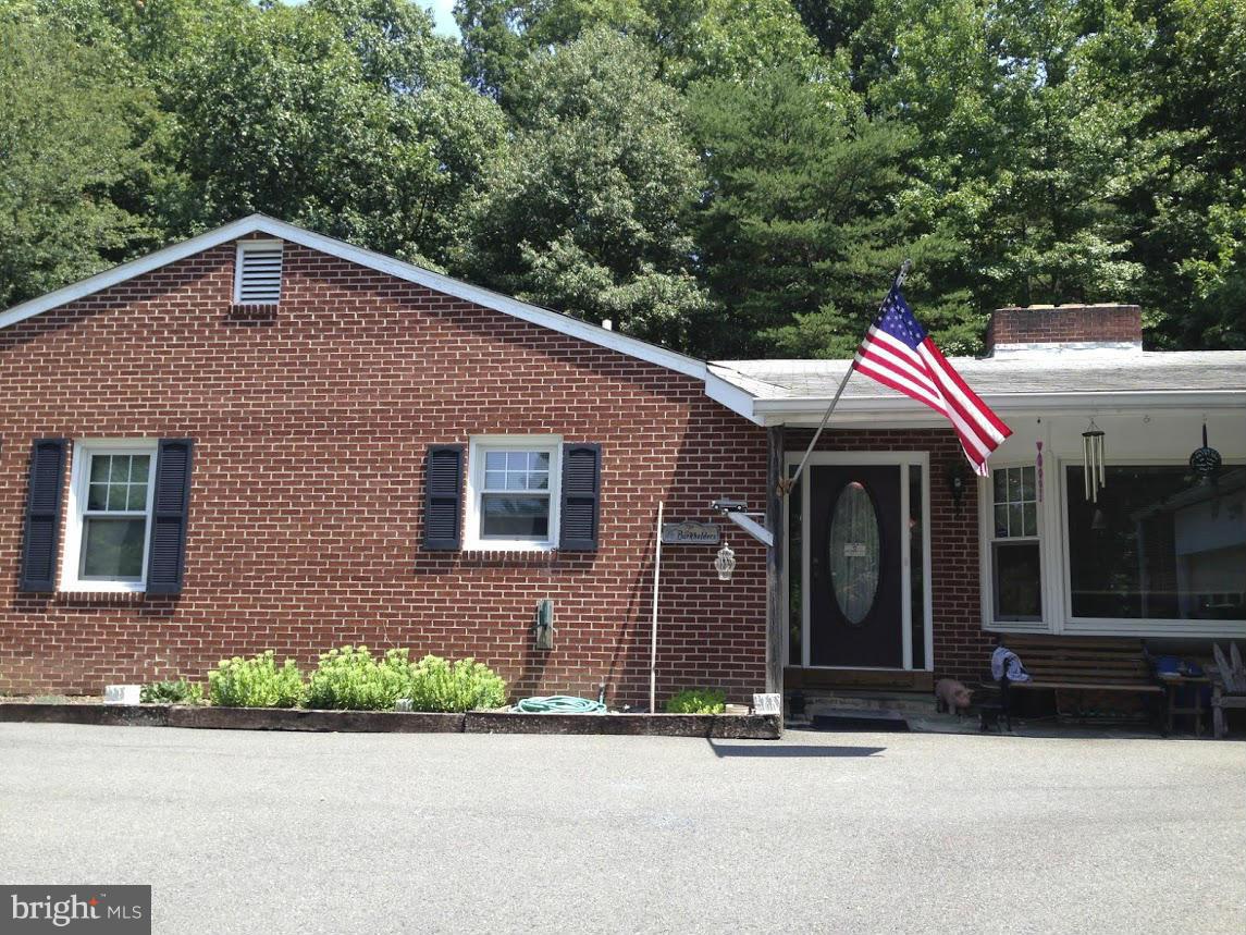 a view of house with yard