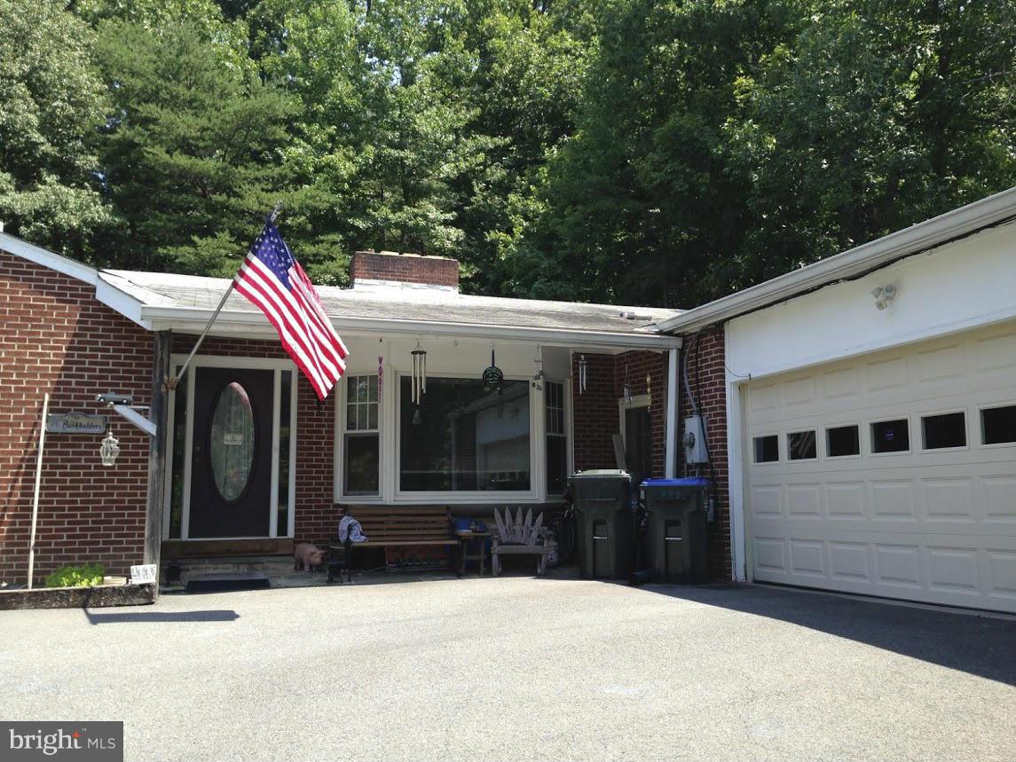 7109 Barry Road Alexandria, VA 22315 - Photo 2 of 8 a view of a house with a patio