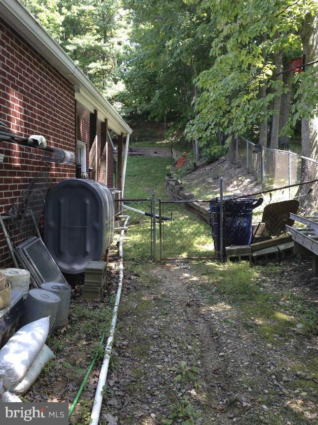 7109 Barry Road Alexandria, VA 22315 - Photo 3 of 8 a backyard of a house with outdoor seating