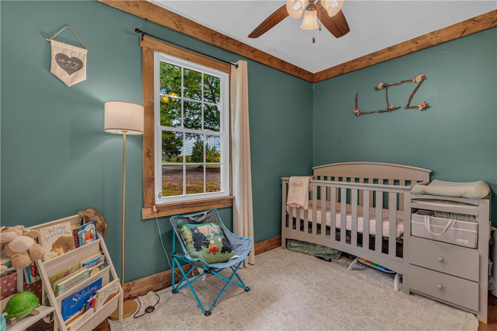 1334 Joe Bolton Road Commerce, GA 30530 - Photo 17 of 45 a bedroom with furniture and a window