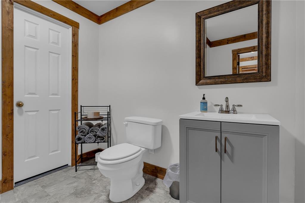 1334 Joe Bolton Road Commerce, GA 30530 - Photo 18 of 45 a bathroom with a toilet a sink and mirror