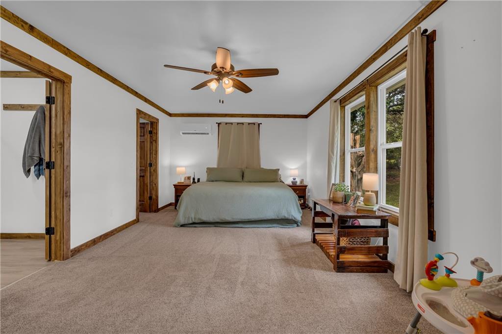 1334 Joe Bolton Road Commerce, GA 30530 - Photo 19 of 45 a bedroom with a bed and a window