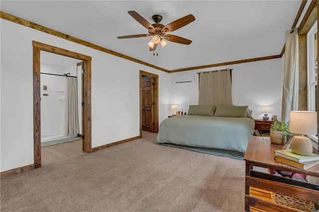 a bedroom with a bed and window