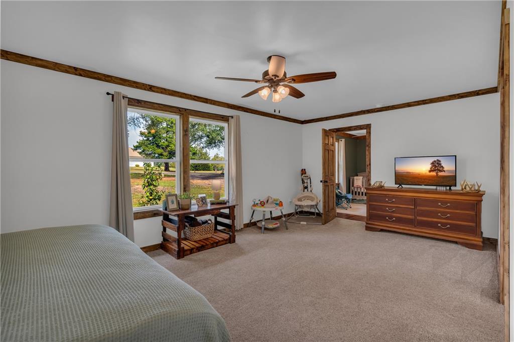 1334 Joe Bolton Road Commerce, GA 30530 - Photo 23 of 45 a bed room with furniture and a window