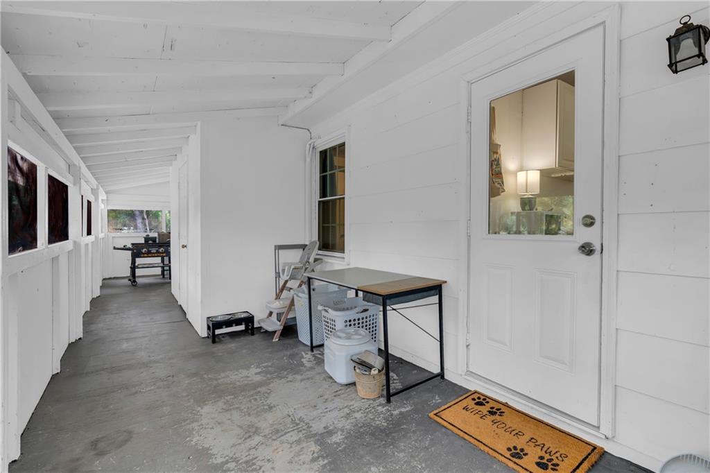 1334 Joe Bolton Road Commerce, GA 30530 - Photo 32 of 45 a view of a hallway with workspace and a window