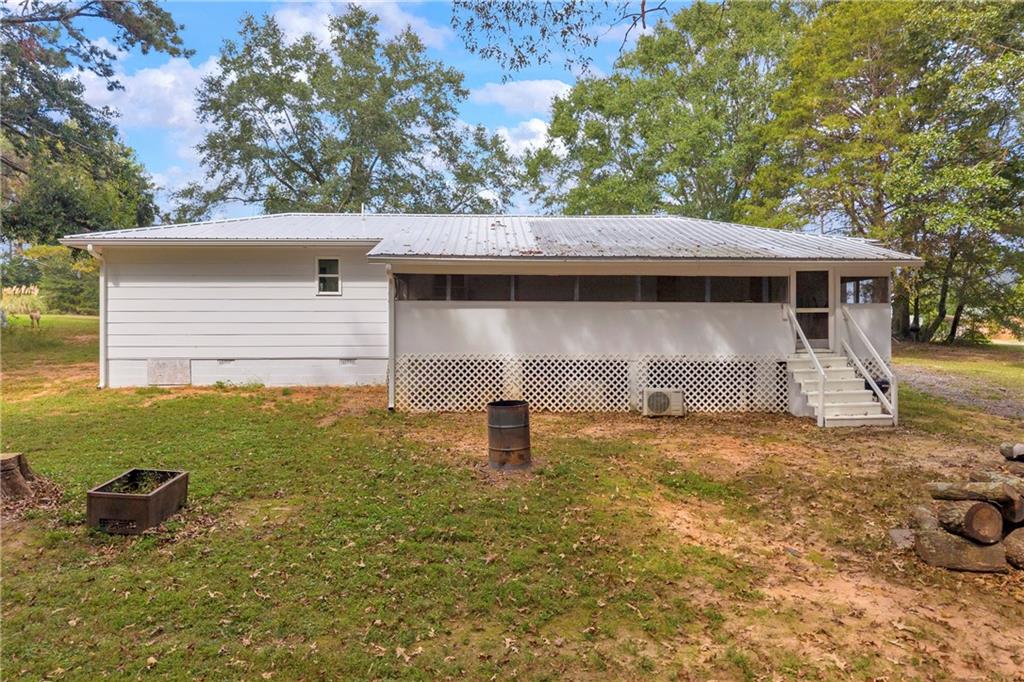 1334 Joe Bolton Road Commerce, GA 30530 - Photo 33 of 45 a front view of a house with a yard