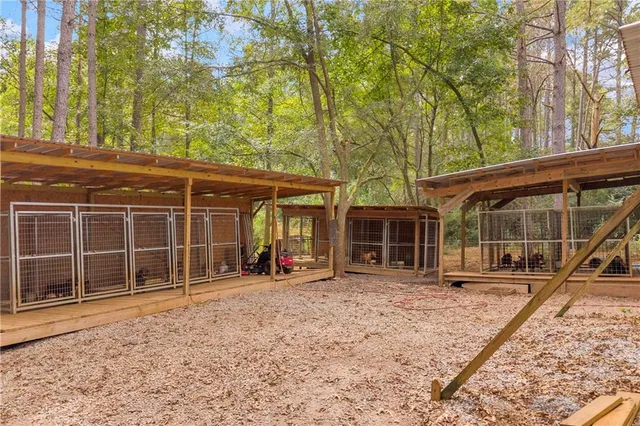 a view of a house with backyard and porch