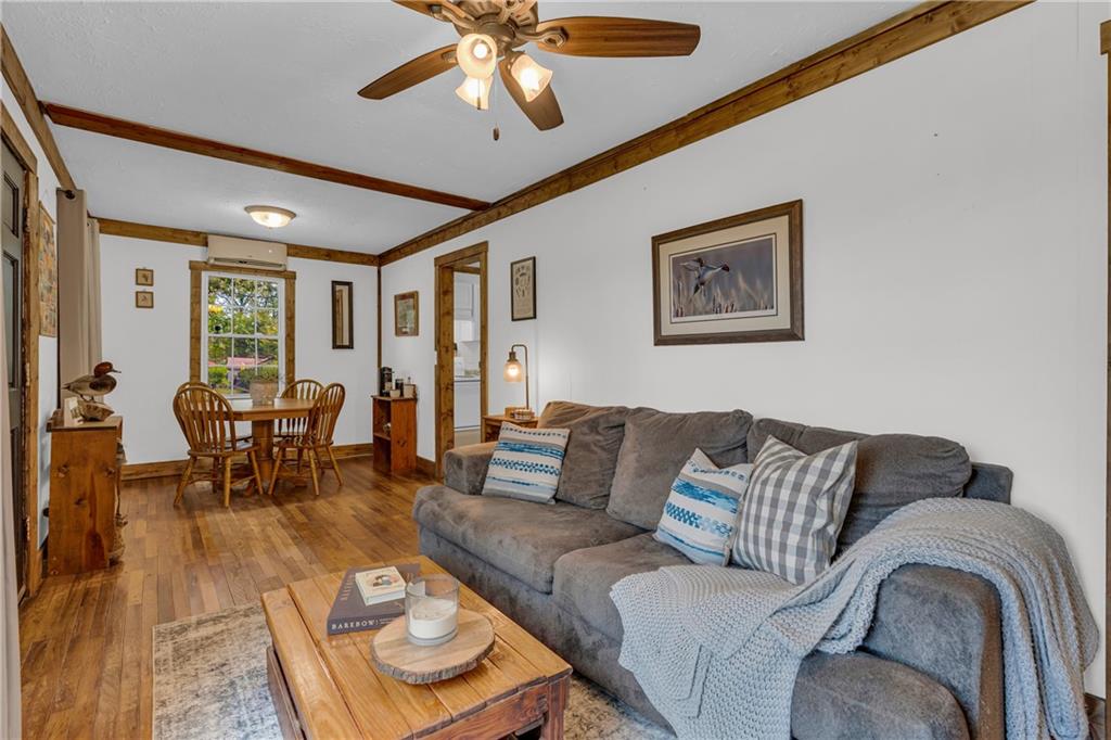 1334 Joe Bolton Road Commerce, GA 30530 - Photo 7 of 45 a living room with furniture and a large window