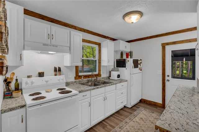a kitchen that has a cabinets and a stove