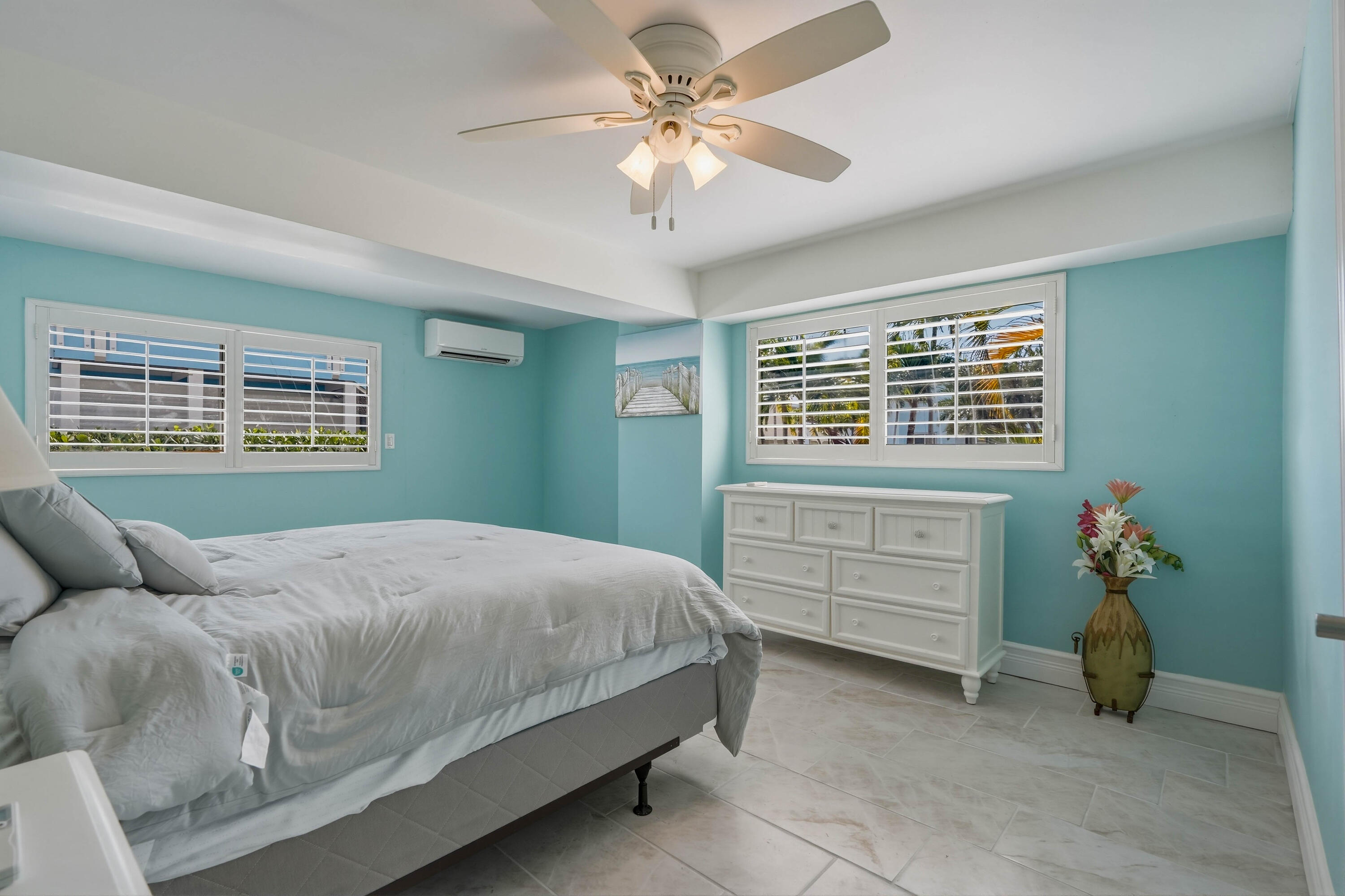 320 5th Street Key Colony Beach, FL 33051 - Photo 41 of 53 a bedroom with a bed and a chandelier