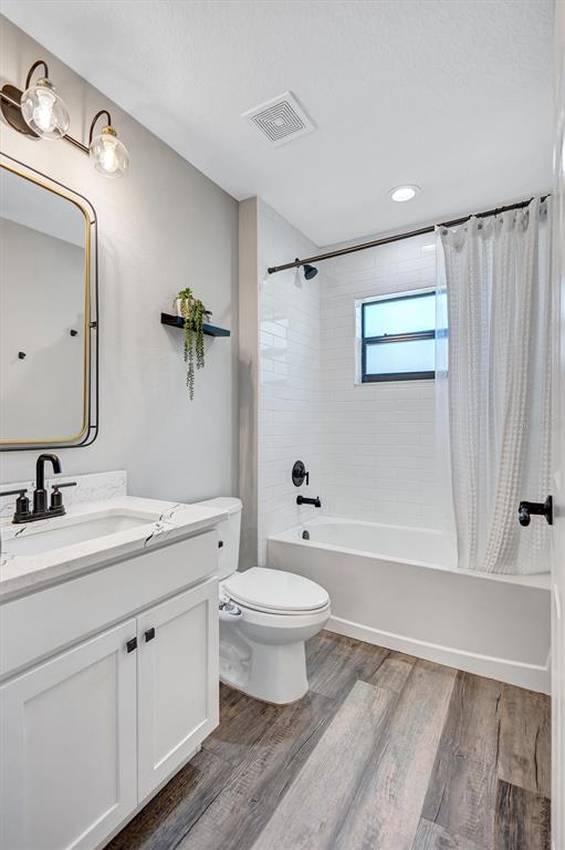 13362 Downy Woodpecker Road Weeki Wachee, FL 34614 - Photo 14 of 26 a bathroom with a sink a toilet and shower