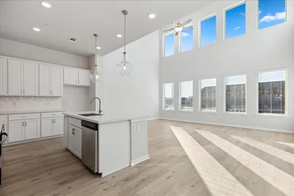 a kitchen with stainless steel appliances granite countertop a stove and a sink