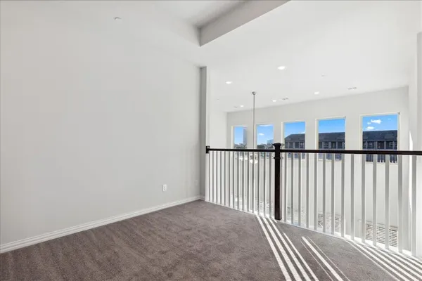 a view of a hallway with a window