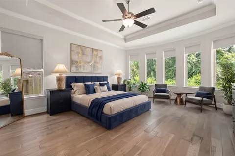 a spacious bedroom with a large bed and a couch
