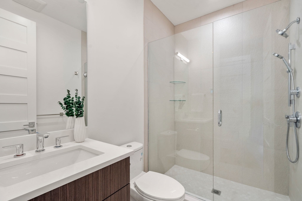 956 Walnut Street, Unit 7 Newton, MA 02461 - Photo 14 of 33 a bathroom with a sink toilet and shower