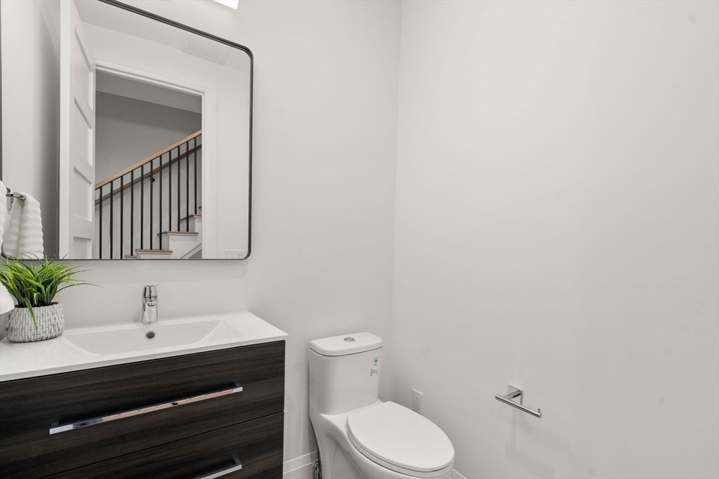 956 Walnut Street, Unit 7 Newton, MA 02461 - Photo 24 of 33 a bathroom with a sink and a toilet