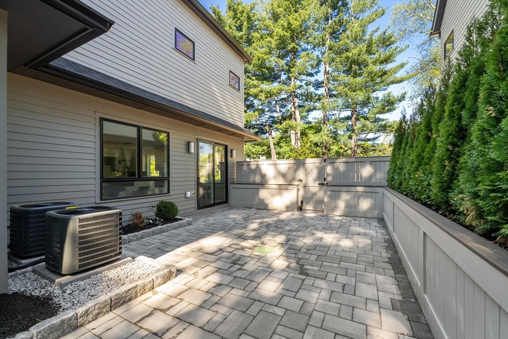 956 Walnut Street, Unit 7 Newton, MA 02461 - Photo 30 of 33 a front view of a house with garden