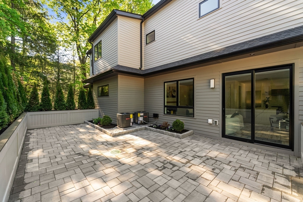 956 Walnut Street, Unit 7 Newton, MA 02461 - Photo 31 of 33 a view of a house with backyard and sitting area