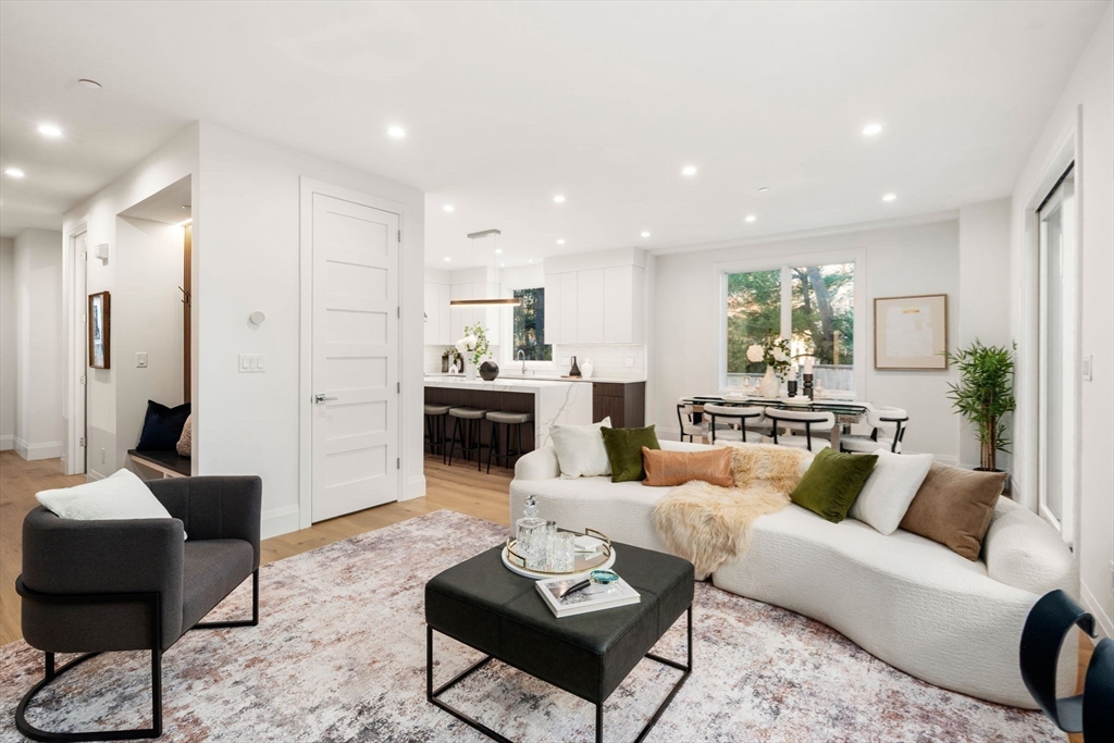 956 Walnut Street, Unit 7 Newton, MA 02461 - Photo 7 of 33 a living room with furniture and a view of kitchen