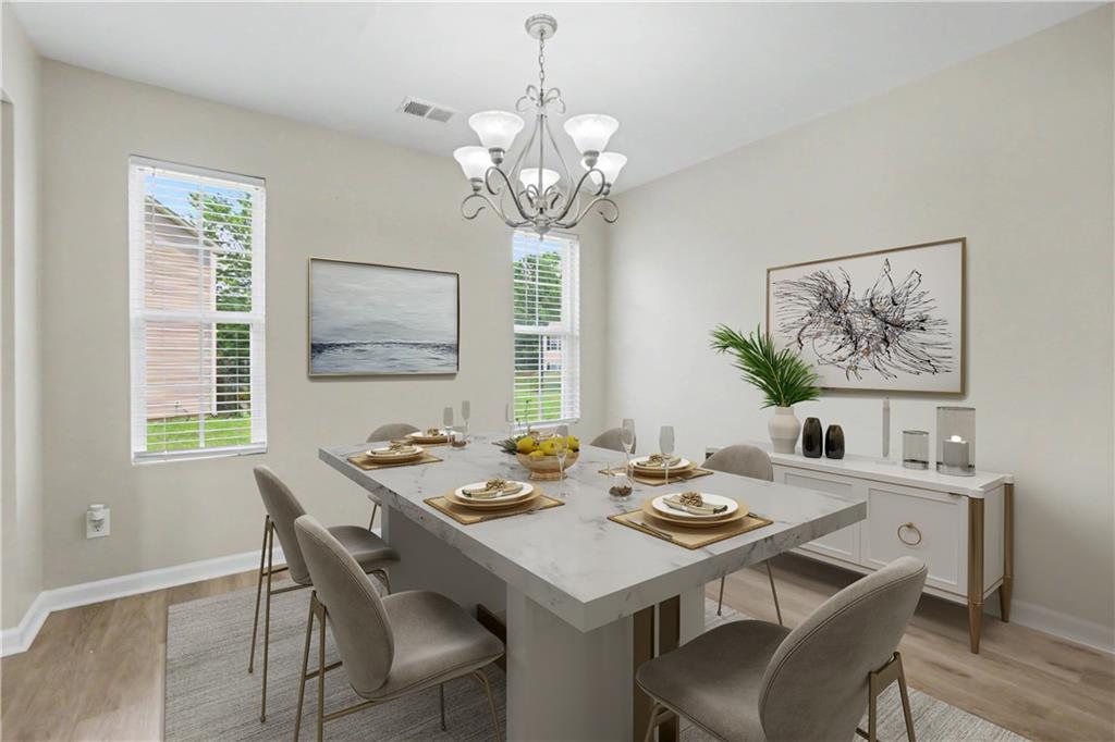 375 Walton View Fairburn, GA 30213 - Photo 8 of 38 a view of a dining room with furniture window and wooden floor