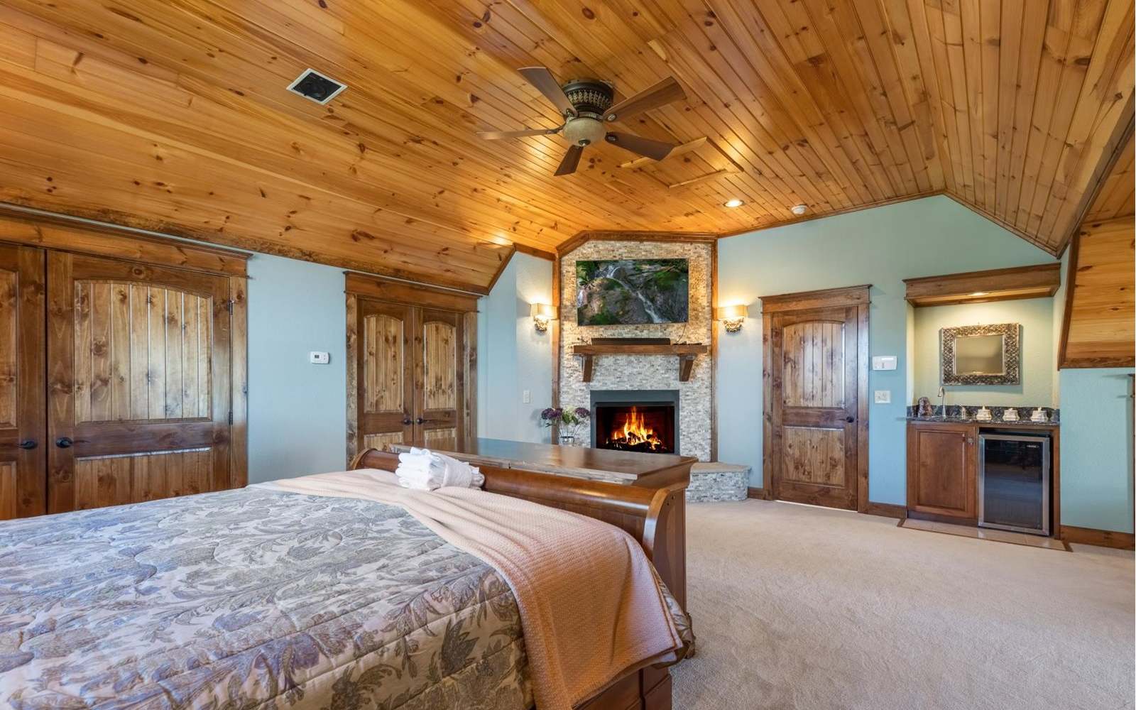 71 Messer Loop Blue Ridge, GA 30513 - Photo 22 of 59 a bedroom with a bed and a fireplace