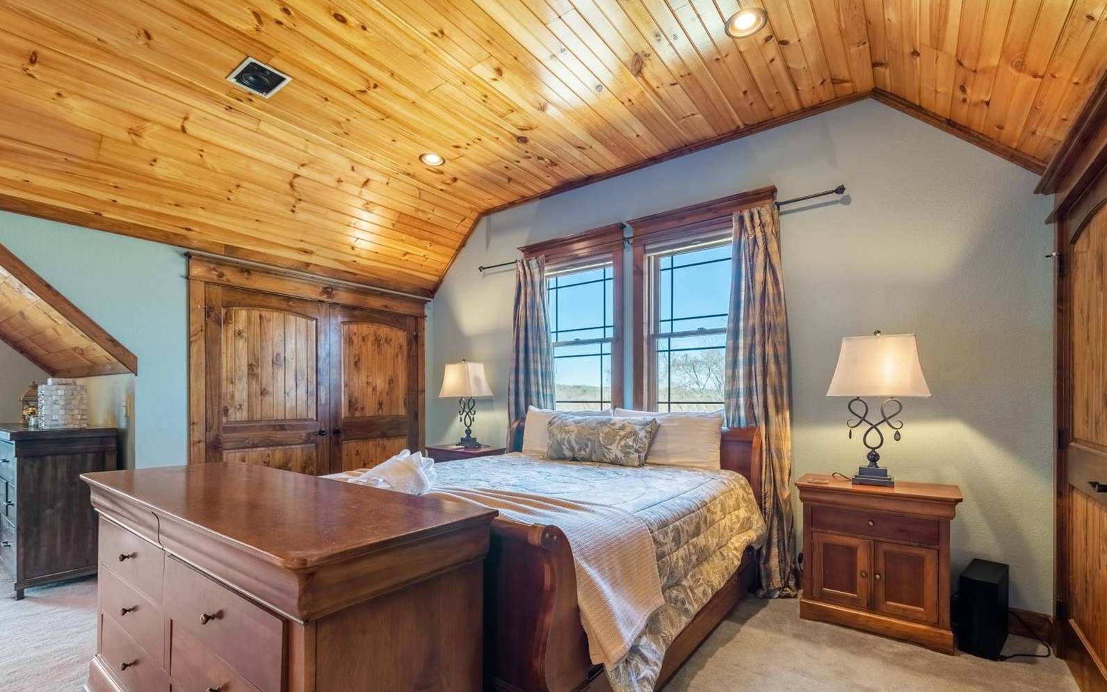 71 Messer Loop Blue Ridge, GA 30513 - Photo 29 of 59 a bedroom with a bed and a chandelier