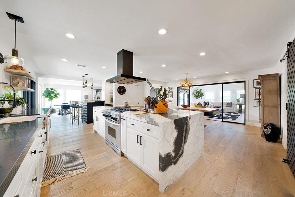 13862 Gimbert Lane North Tustin, CA 92705 - Photo 16 of 63 a large kitchen with stainless steel appliances a lot of counter space and a large window