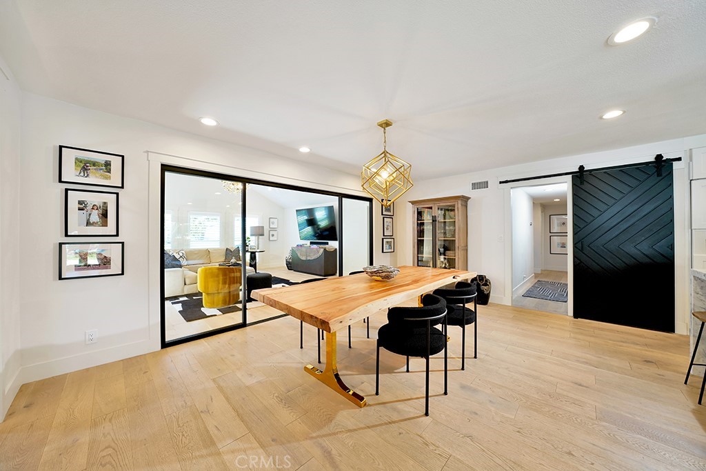 13862 Gimbert Lane North Tustin, CA 92705 - Photo 17 of 63 a view of a dining room with furniture window and wooden floor
