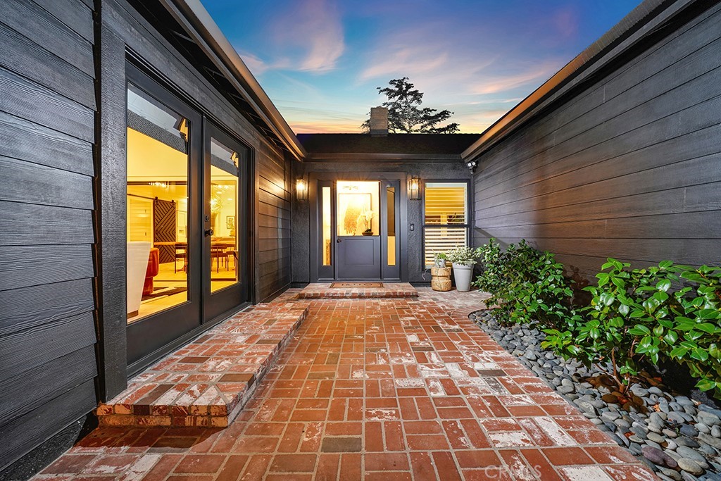 13862 Gimbert Lane North Tustin, CA 92705 - Photo 2 of 63 a view of an entryway with a chandelier
