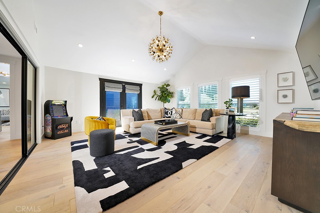 13862 Gimbert Lane North Tustin, CA 92705 - Photo 23 of 63 a living room with couches couches and a flat screen tv