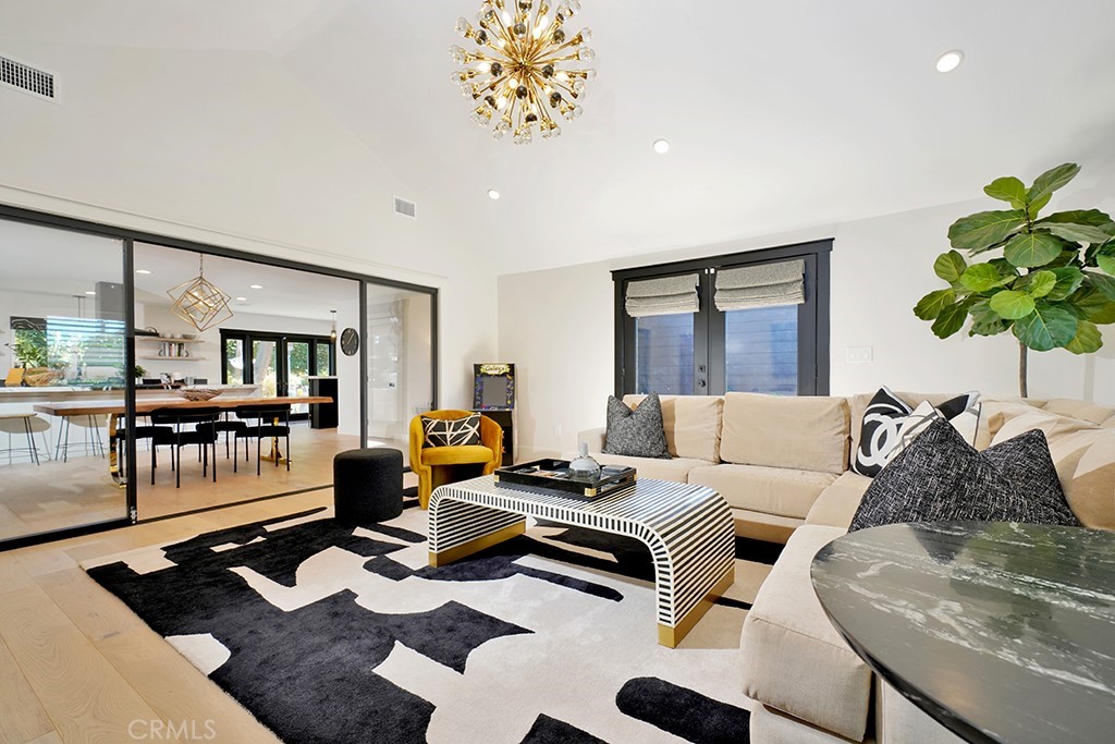 13862 Gimbert Lane North Tustin, CA 92705 - Photo 24 of 63 a living room with furniture a rug and a potted plant