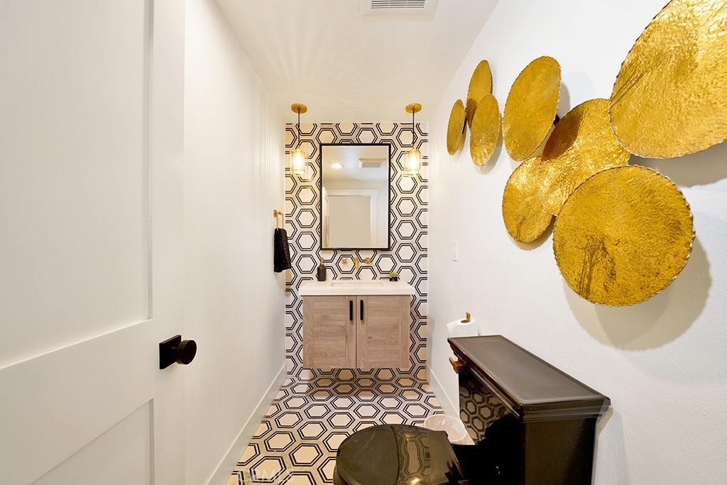 13862 Gimbert Lane North Tustin, CA 92705 - Photo 26 of 63 a bathroom with a sink mirror and vanity