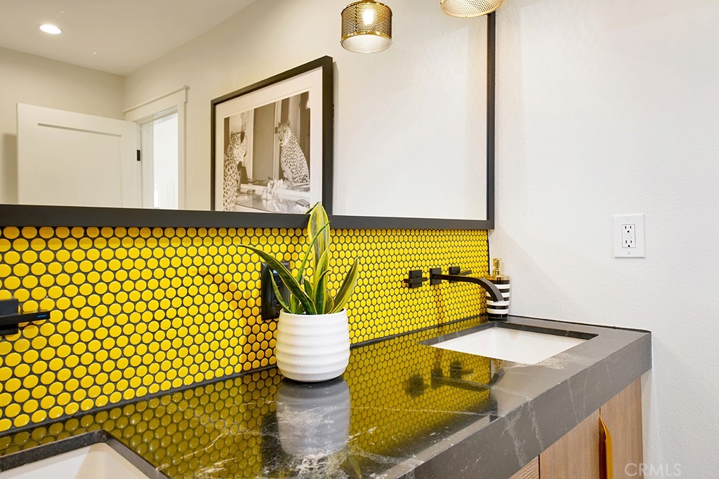 13862 Gimbert Lane North Tustin, CA 92705 - Photo 29 of 63 a bathroom with a sink and a mirror