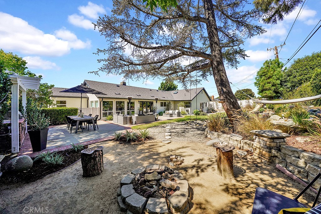 13862 Gimbert Lane North Tustin, CA 92705 - Photo 54 of 63 a front view of a house with swimming pool