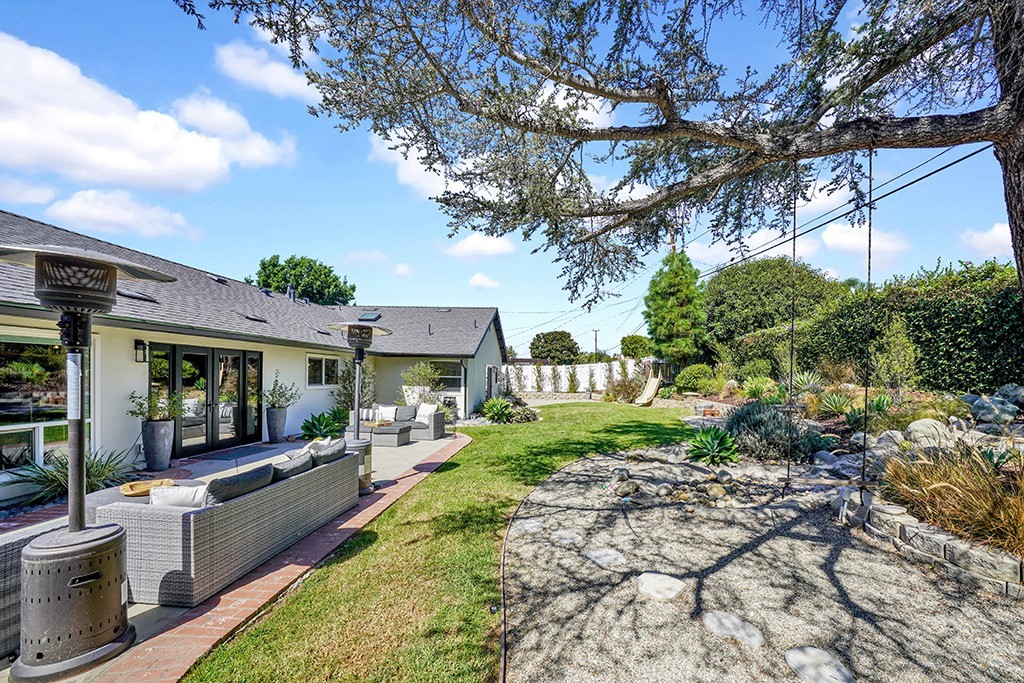 13862 Gimbert Lane North Tustin, CA 92705 - Photo 56 of 63 a view of a patio with couches plants and large trees