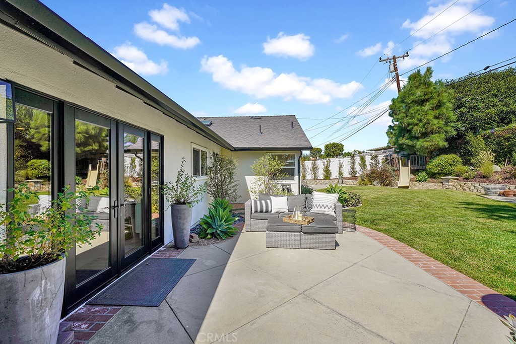 13862 Gimbert Lane North Tustin, CA 92705 - Photo 58 of 63 a view of a patio with couches and table and chairs and potted plants
