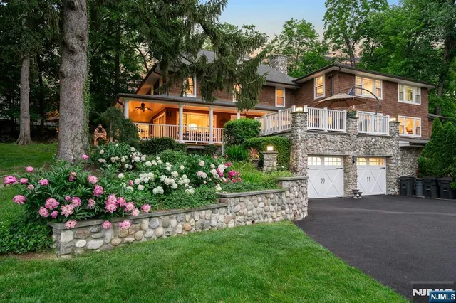 a bathroom with a toilet a sink and a mirror