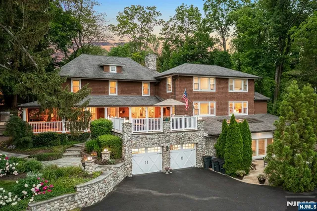 a living room with furniture flat screen tv and a couch