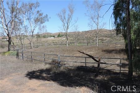 42600 San Ignacio Road Hemet, CA 92544 - Photo 11 of 22 a view of a yard with wooden fence