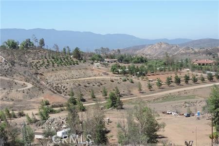 42600 San Ignacio Road Hemet, CA 92544 - Photo 15 of 22 a view of a dry field with mountains in the background
