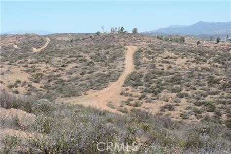 42600 San Ignacio Road Hemet, CA 92544 - Photo 22 of 22 a view of a dry yard with mountains in the background