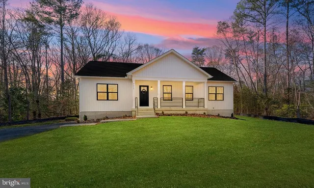 a house with trees in the background