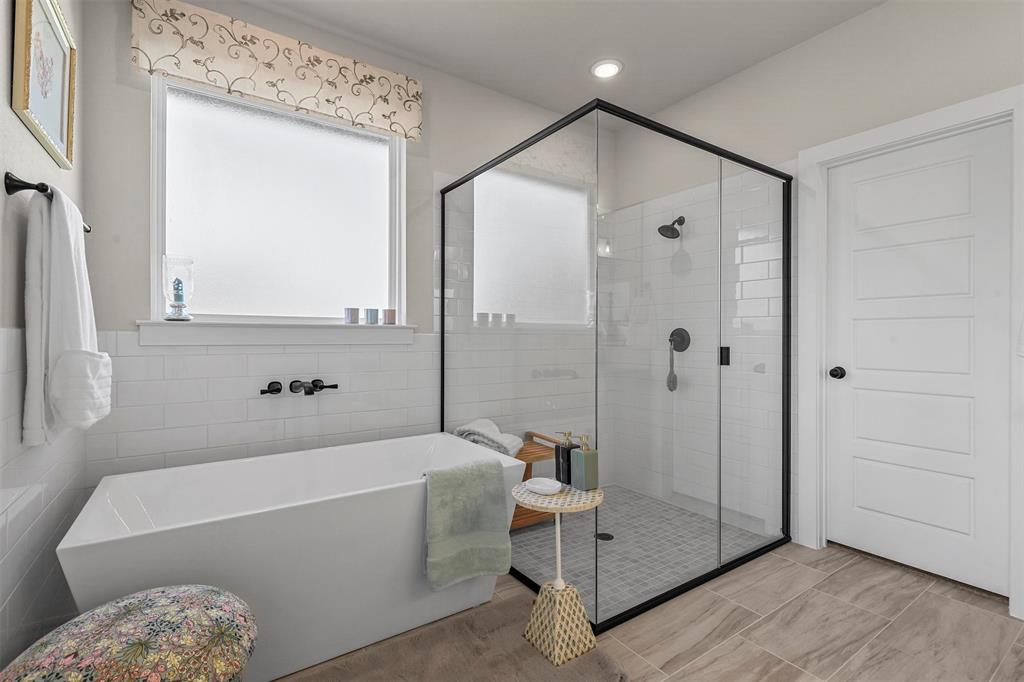 147 Rj Smith Drive Boyd, TX 76023 - Photo 14 of 15 a bathroom with a bathtub and a shower