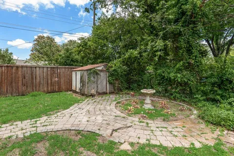 a view of a backyard with a small cabin
