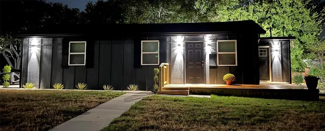 a front view of a house with garden