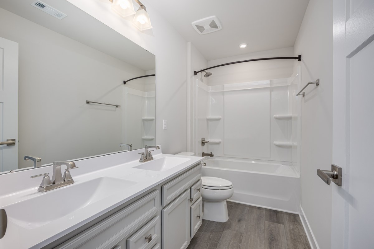 968 Caywood Road Smyrna, TN 37167 - Photo 39 of 54 a bathroom with a bathtub shower sink mirror vanity and toilet